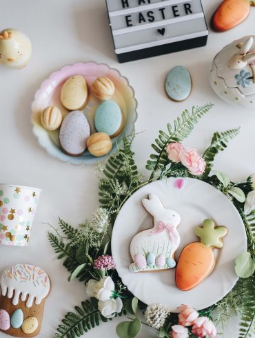 flay lay of easter eggs and wreath on plates