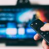remote held in front of a television